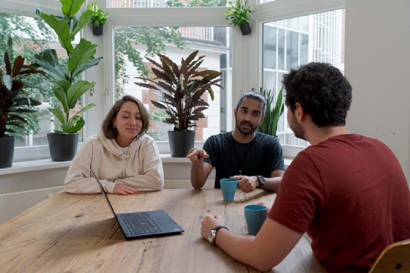 A team meets to map their relationship with stakeholders.